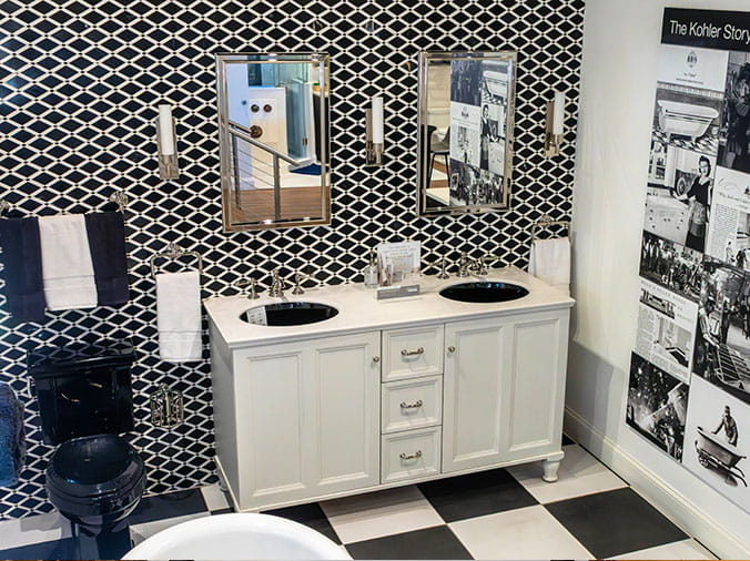 Bathroom sample with white cabinets and black sink in the Weinstein Willow Grove Kitchen & Bath Showroom